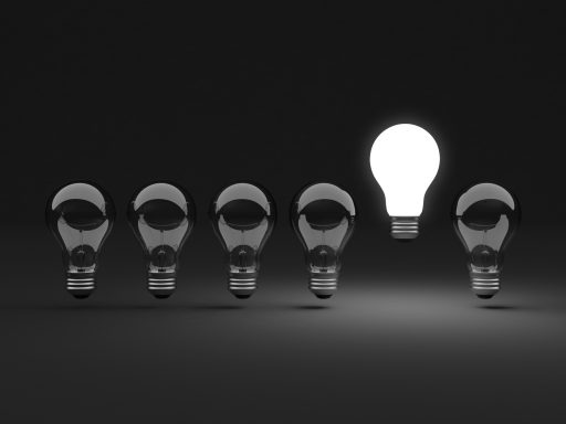 Six light bulbs Six clear light bulbs, one illuminated